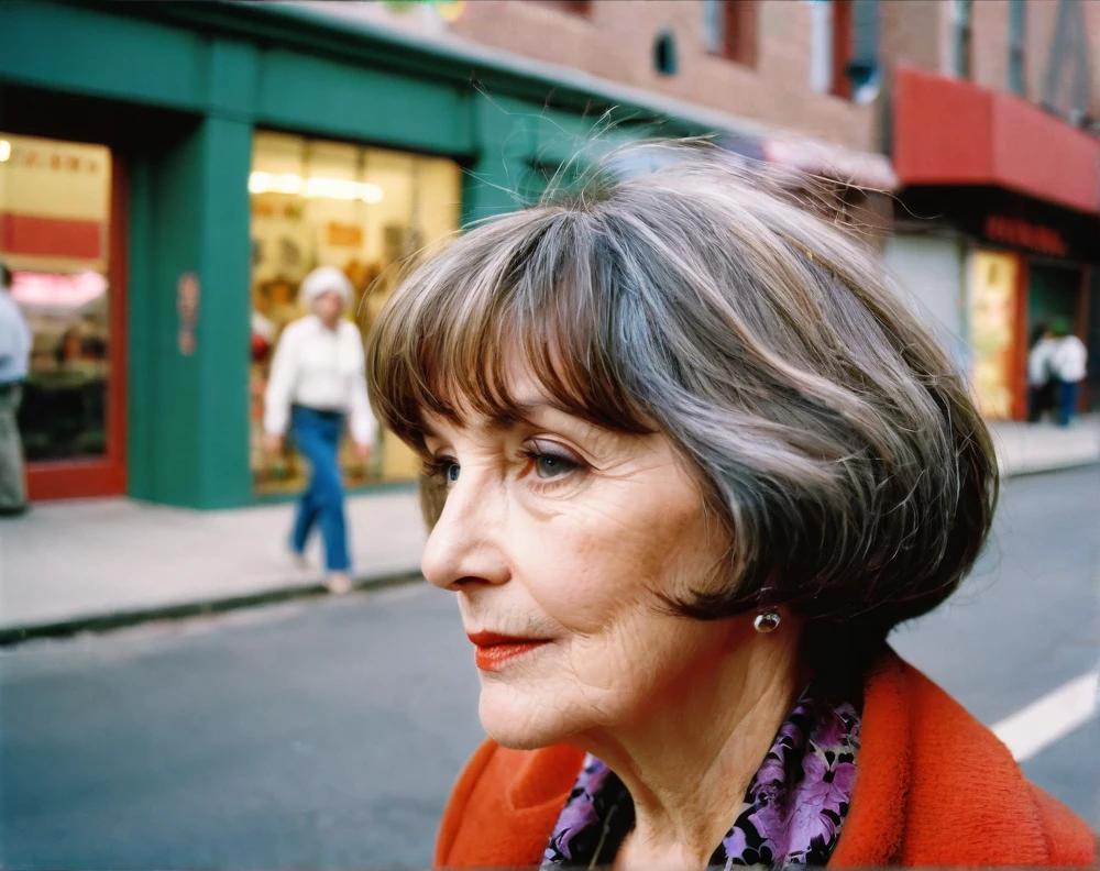 Feathered bob with bangs on a stylish 60-year-old woman, offering a light, textured style with soft volume.