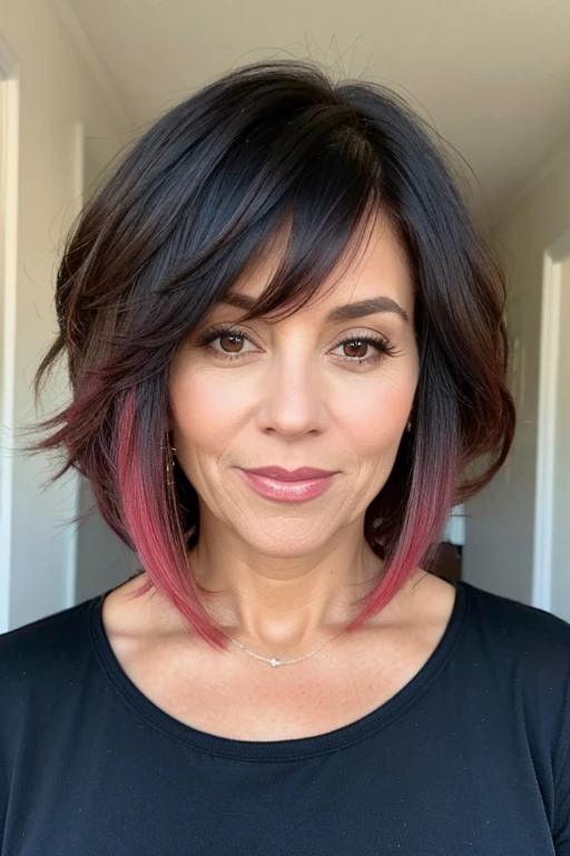 Layered ombre bob for women over 50 with fine hair, featuring gradient color and layers for depth.